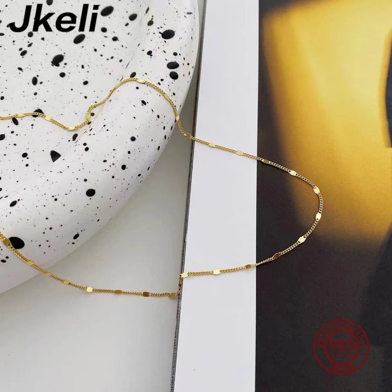 Sterling silver women's necklace with delicate chain and minimalist design, showcasing elegant jewelry by LAQTA.