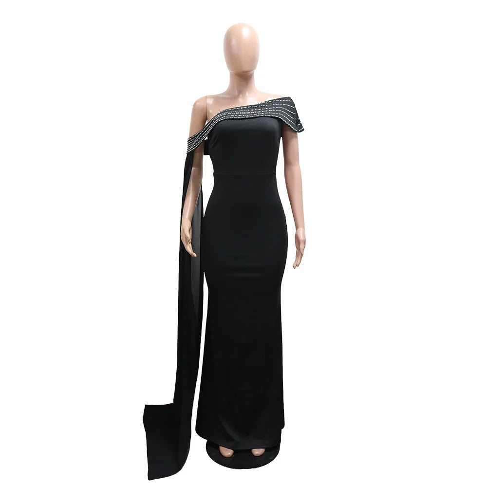 LAQTA sexy rhinestone patchwork bodycon long dress, close-up of fitted black dress with sparkling embellishments and intricate design.