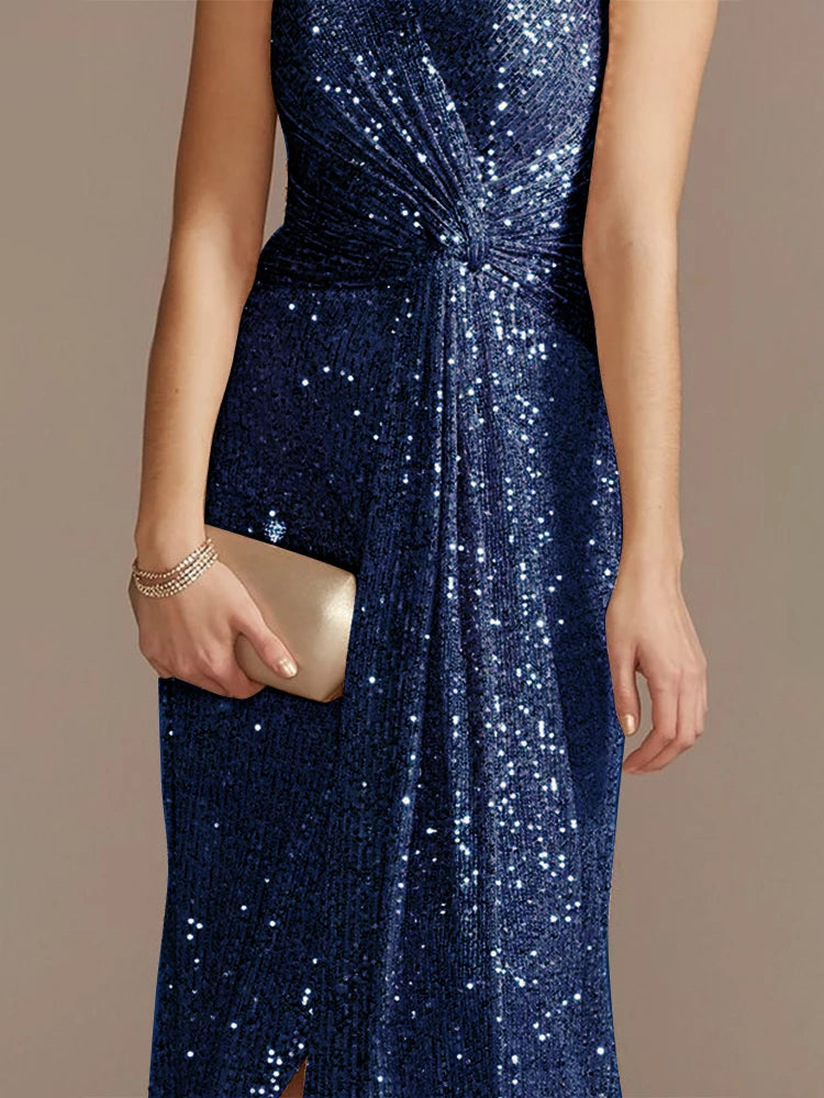 Elegant evening dress by LAQTA featuring a flowing fabric and intricate design, displayed on a mannequin.