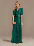 Elegant green evening dress by LAQTA featuring a flowing fabric and sophisticated design for formal occasions.