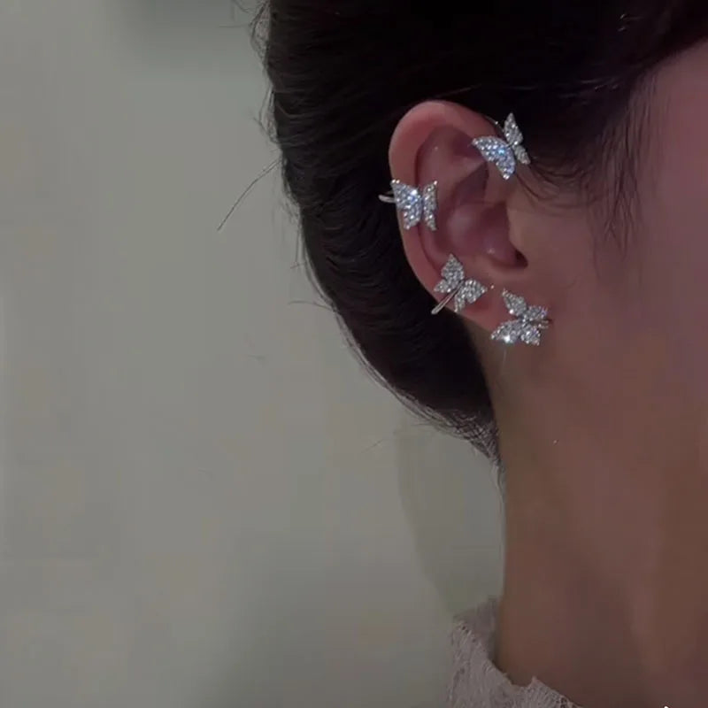 Korean style butterfly ear clips by LAQTA, featuring delicate butterfly design on silver-tone metal for a stylish accessory.