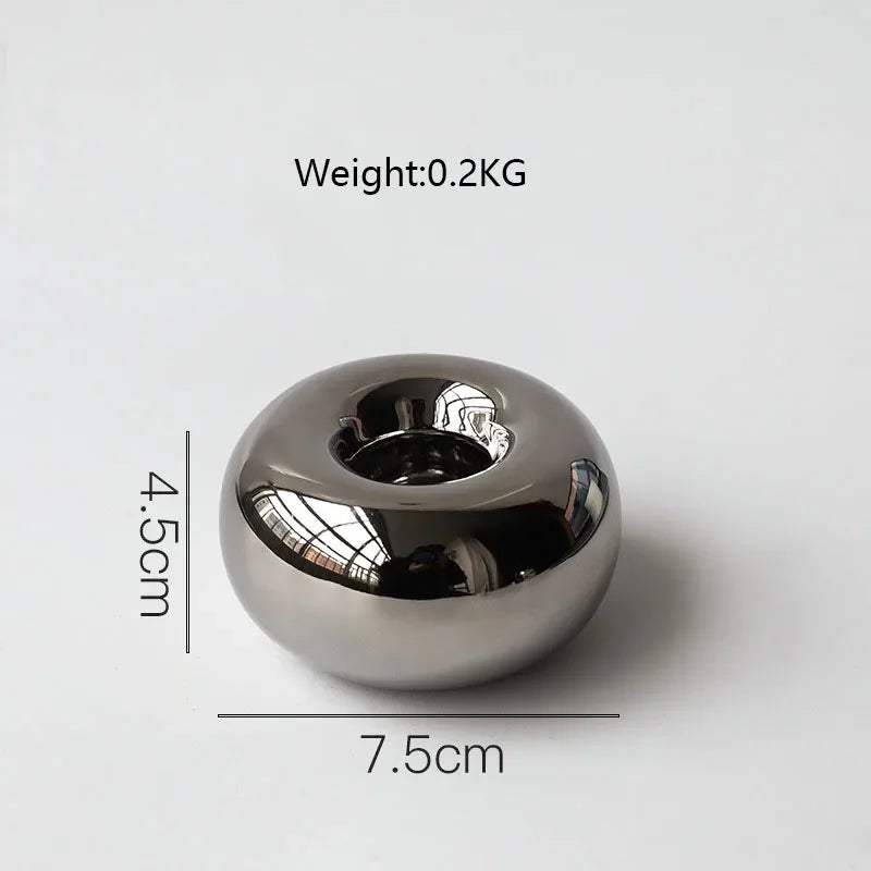 Silver geometric ceramic candlestick by LAQTA with a sleek, modern electroplating finish and elegant design.