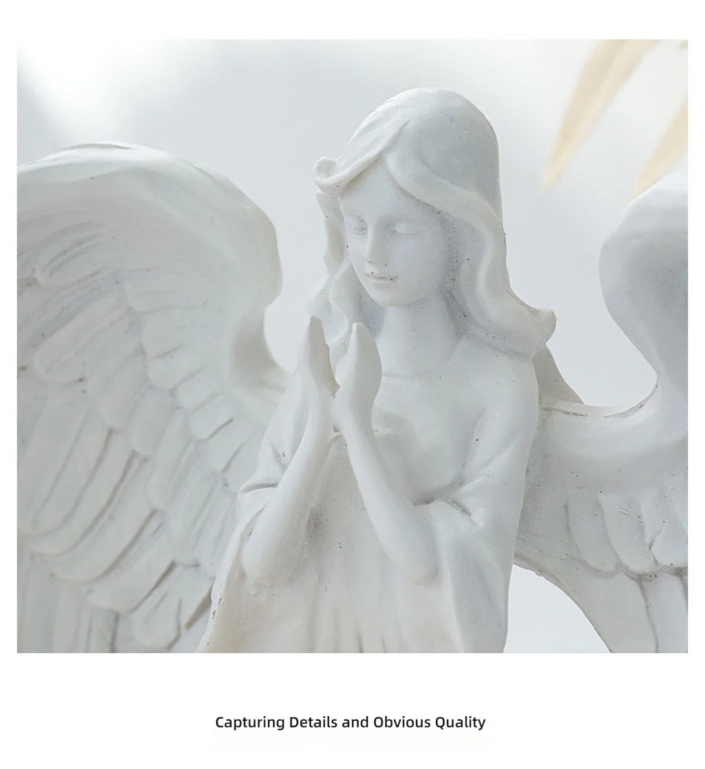 White angel candle holder by LAQTA featuring a detailed angel design and a wide base for stability.