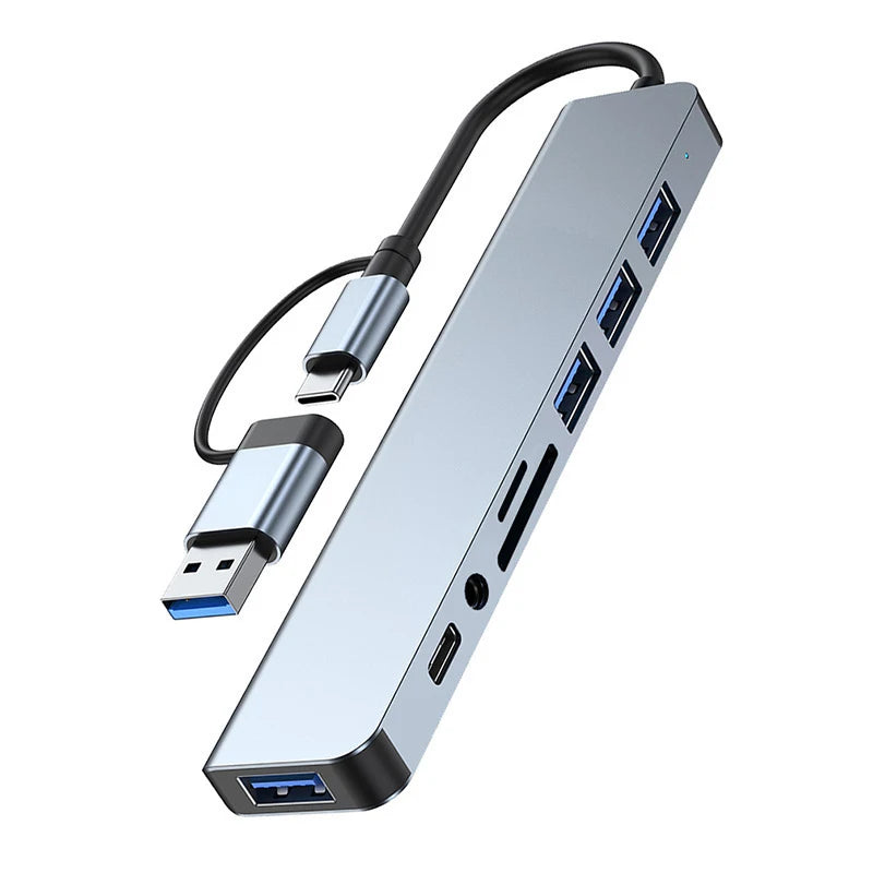 LAQTA 8-in-1 USB and Type C HUB Docking Station showing multiple ports including HDMI, USB, and Ethernet connections.