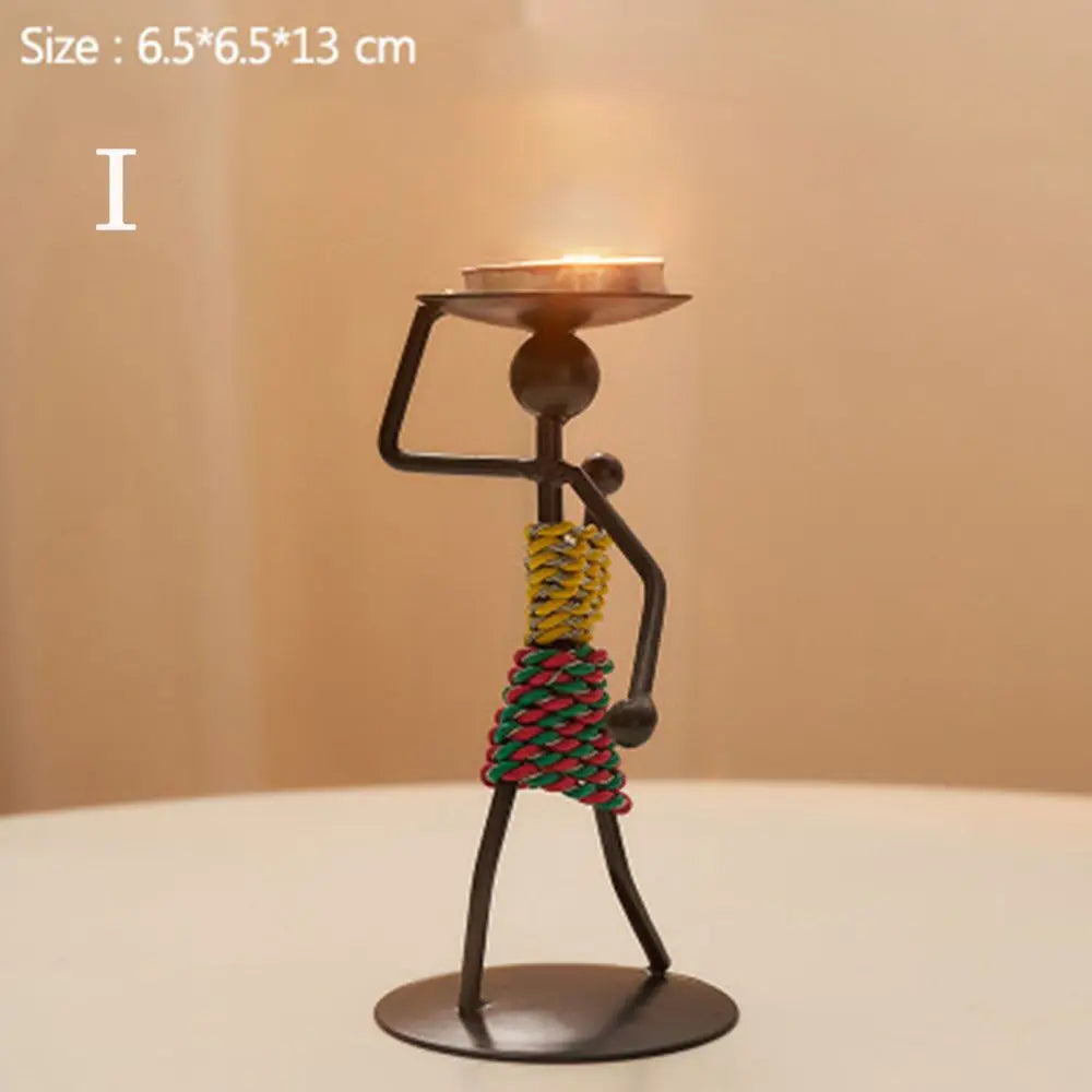 Nordic metal candlestick by LAQTA featuring a sleek, minimalist design with a tall, cylindrical shape and a broad base.