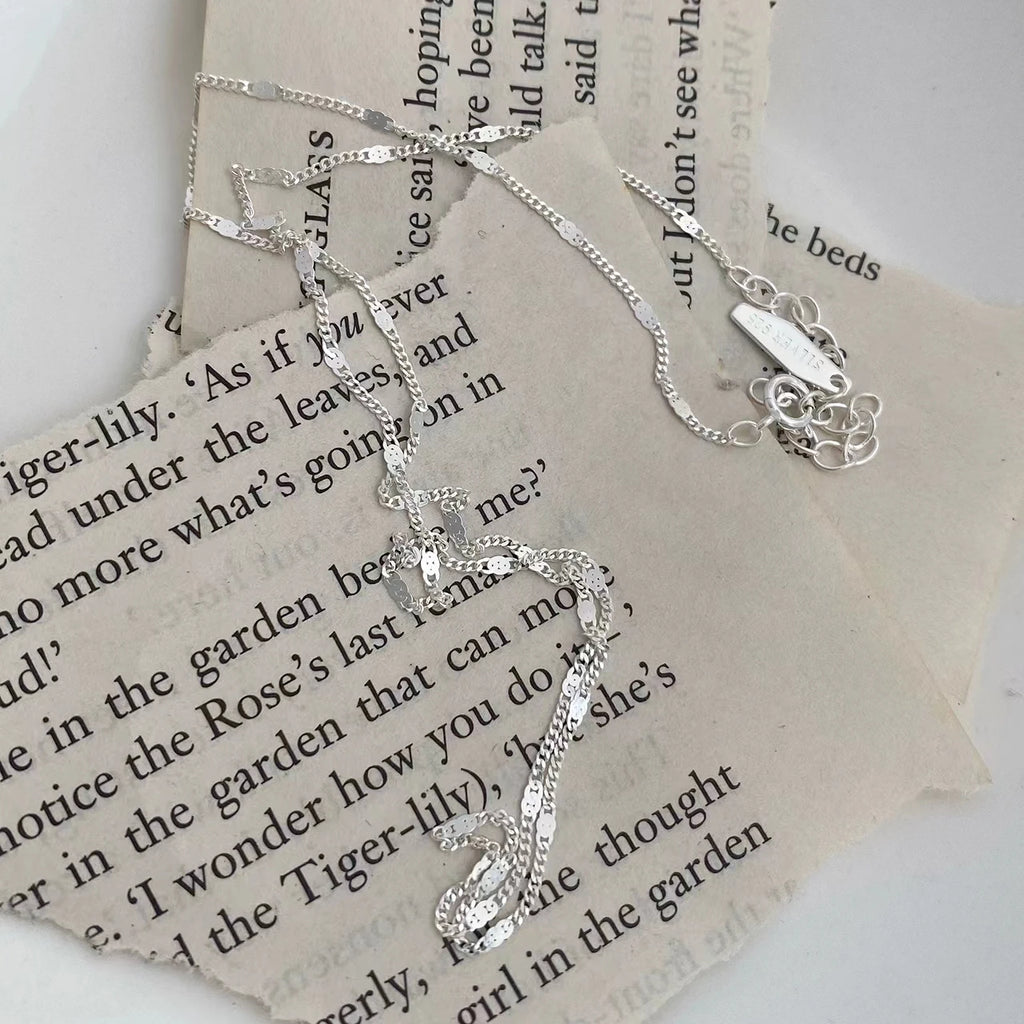 Sterling silver women's necklace with delicate chain, elegant jewelry accessory by LAQTA, shown on a neutral background.