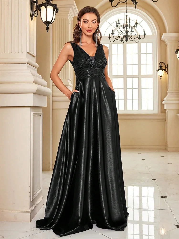 Elegant sequins evening dress by LAQTA featuring a fitted silhouette and shimmering embellishments for formal occasions.