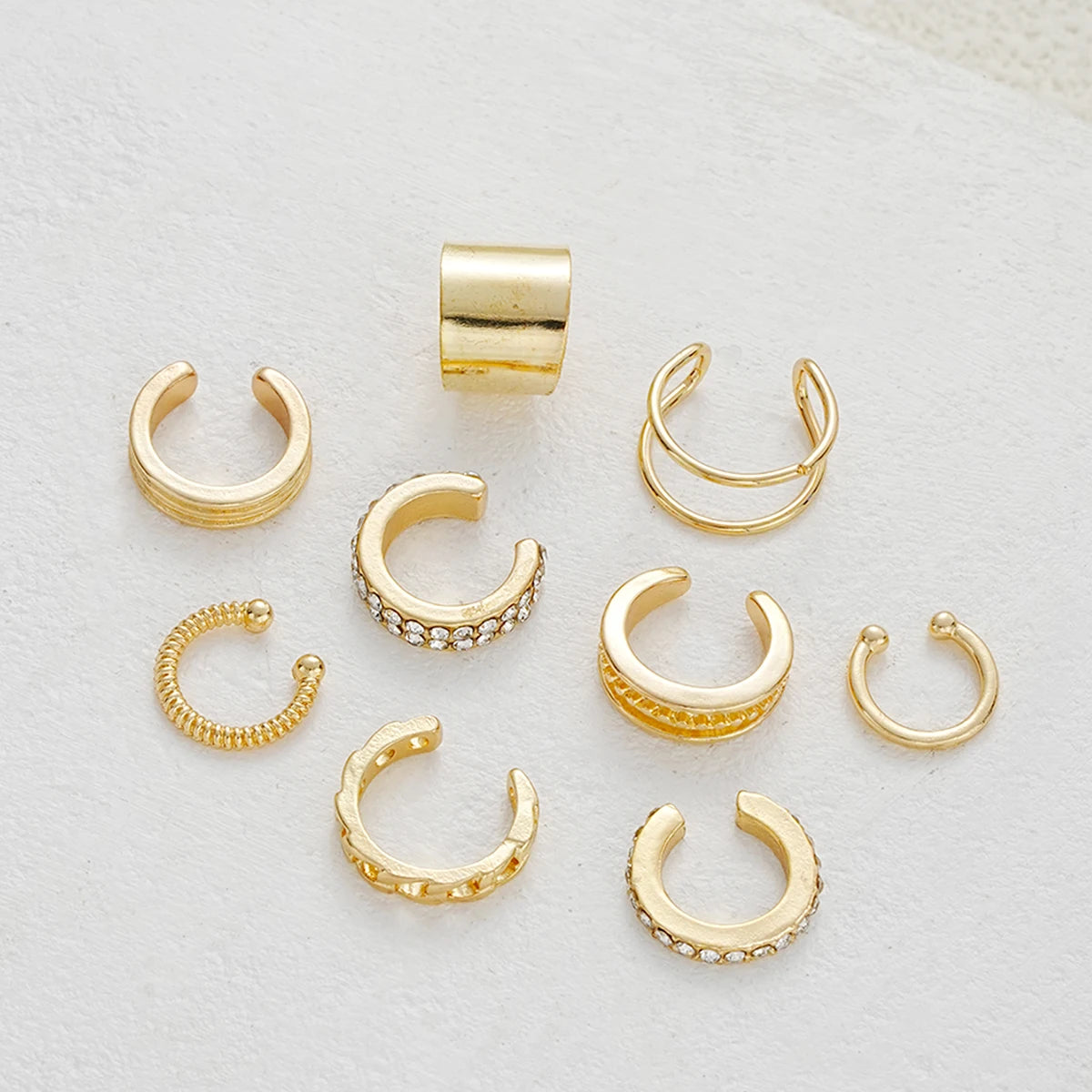 Gold rhinestone clip-on earrings set by LAQTA featuring sparkling stones and elegant design.