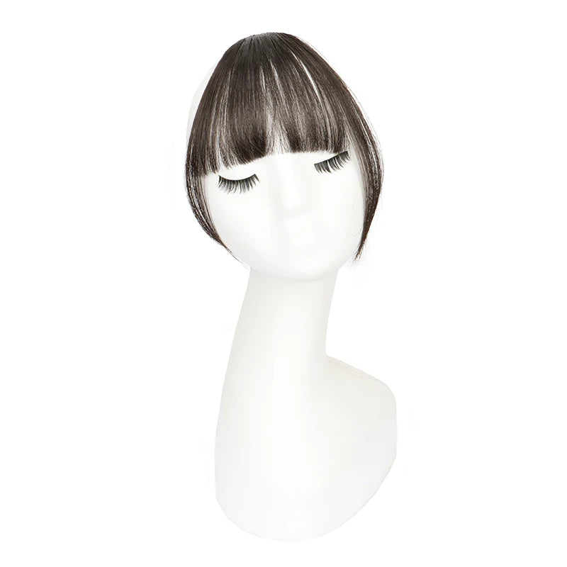 Synthetic invisible hair bangs by LAQTA, showing a close-up of soft, natural-looking black hair bangs on a mannequin head.