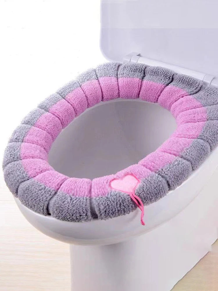 Colorful stitched knitted portable toilet mat by LAQTA, showing soft, textured fabric with stitched edges in a close-up view.