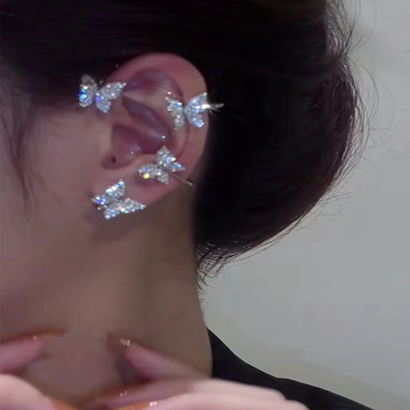 Korean style butterfly ear clips by LAQTA featuring gold-tone metal and delicate butterfly design, styled as fashionable ear accessories.