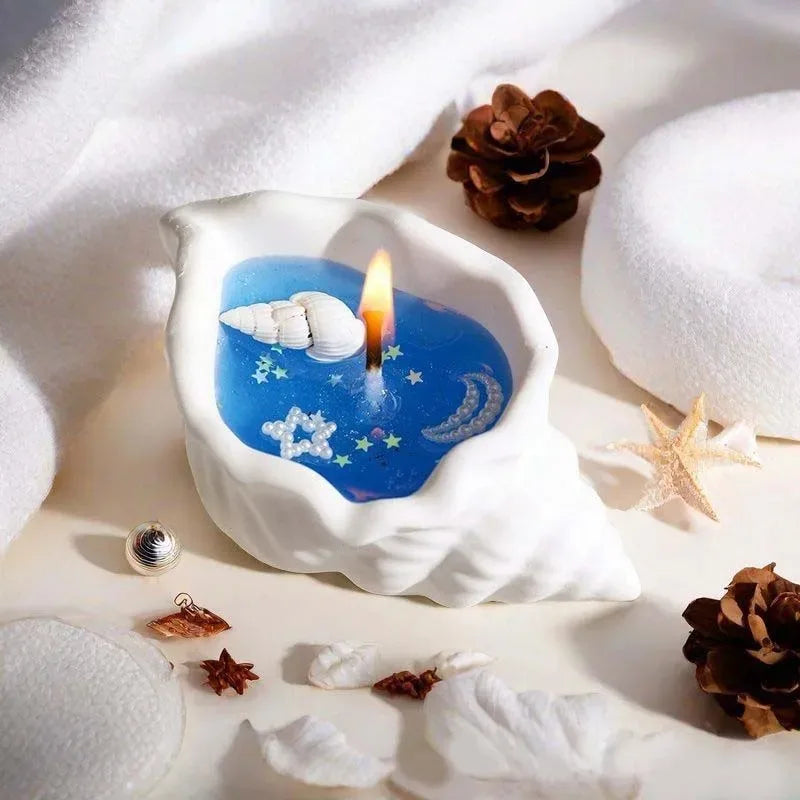 Sea shell aromatherapy candle by LAQTA featuring a natural shell design and soft candlelight for relaxing ambiance.