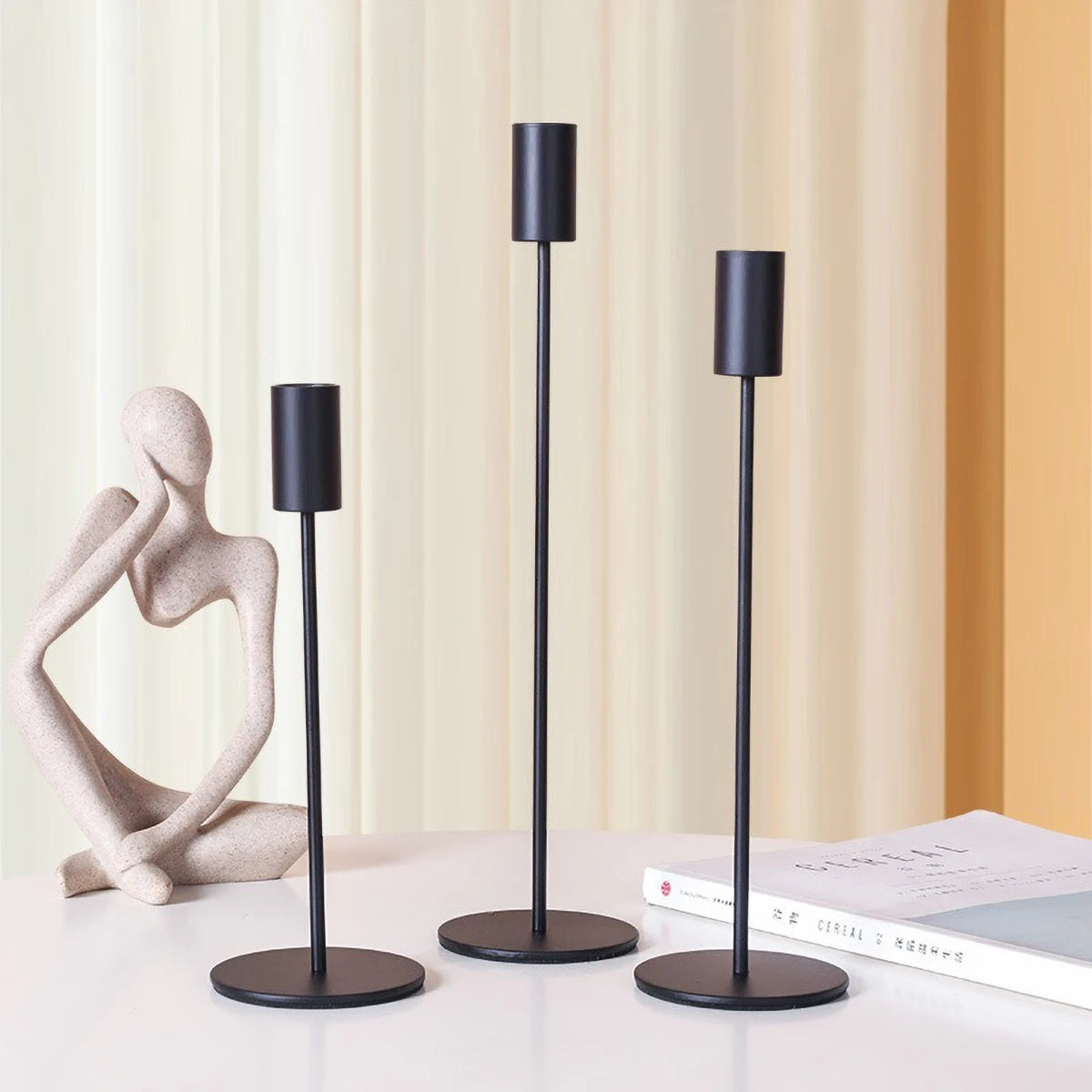 Elegant gold candlestick holder by LAQTA with a sleek, polished design suitable for decorative or functional use.