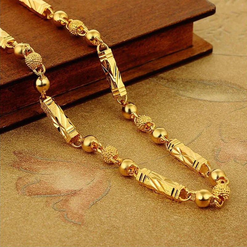 Electroplated 18K gold necklace by LAQTA featuring a sleek, elegant design with a shiny finish.