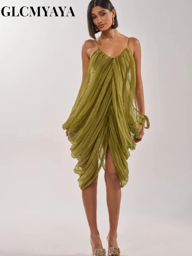 LAQTA sheer mesh dress with draped fabric and plunging neckline, showcasing intricate design and elegant style.