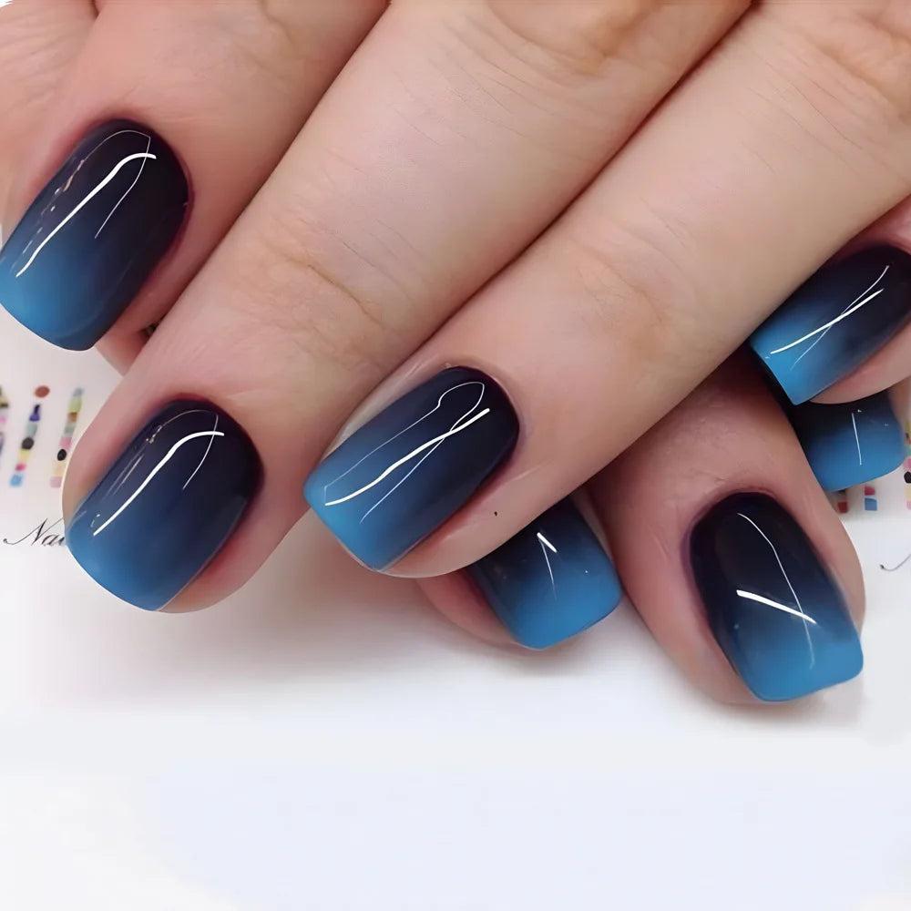 Short square fake nails by LAQTA, showcasing neatly manicured artificial nails with a smooth finish and natural appearance.