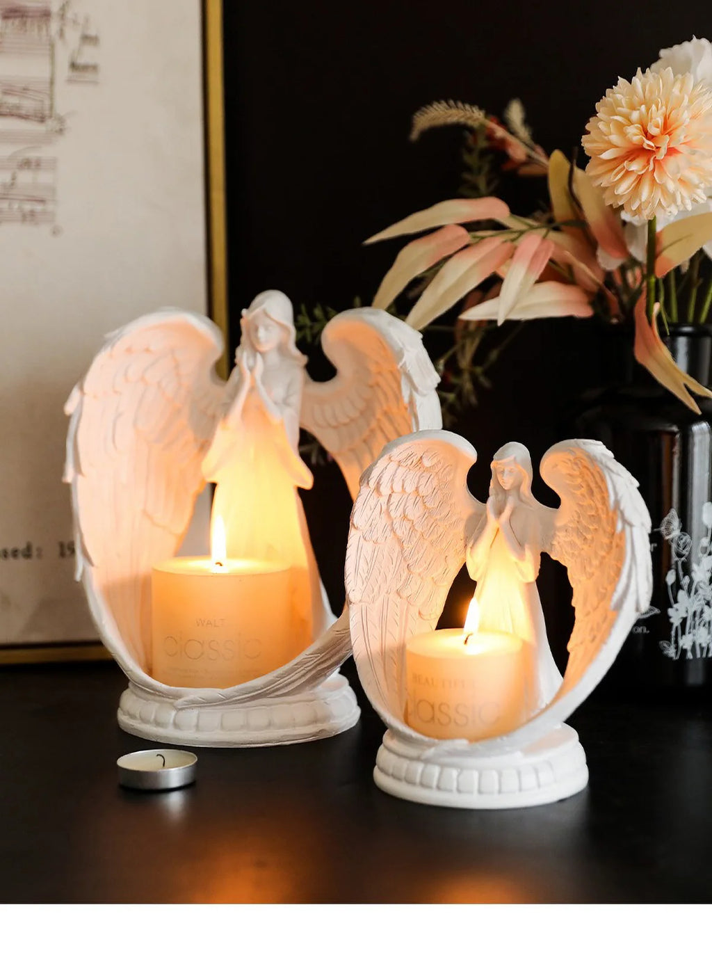 White Angel Candle Holder by LAQTA featuring a detailed angel design with a candle resting on top.