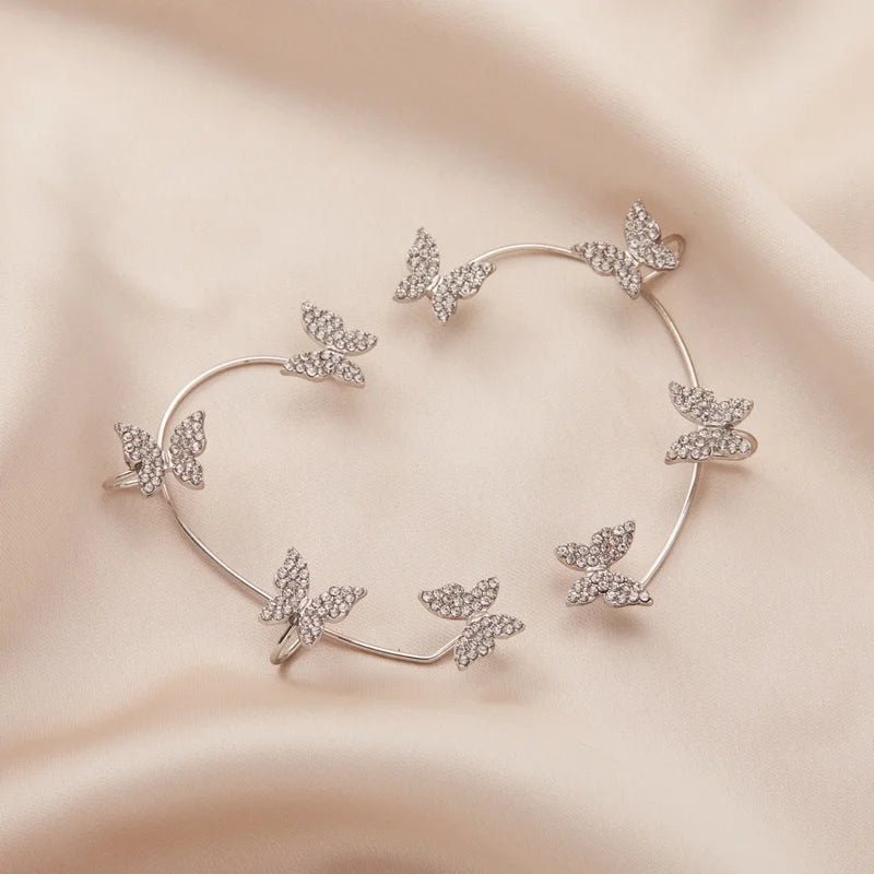 LAQTA Korean style butterfly ear clips featuring delicate butterfly design and elegant gold-tone finish.