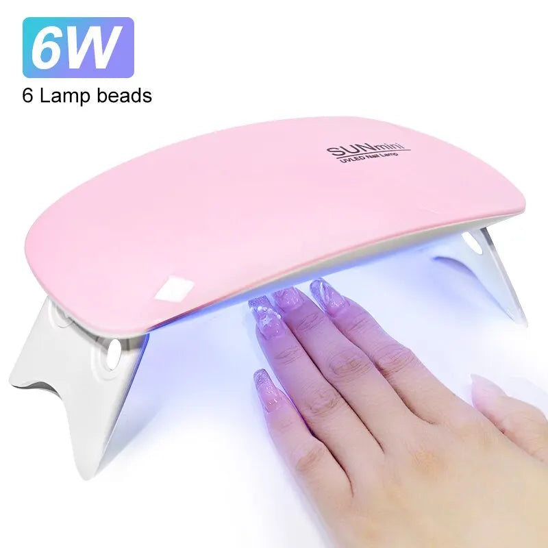LAQTA portable nail dryer with compact design, showing UV/LED light bulbs for quick, efficient nail drying.