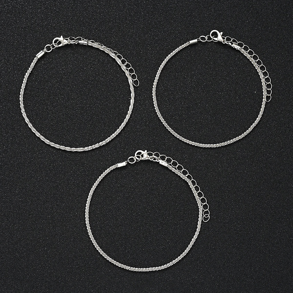 Elegant metal pendant anklet by LAQTA featuring intricate design and delicate chain for stylish ankle jewelry.