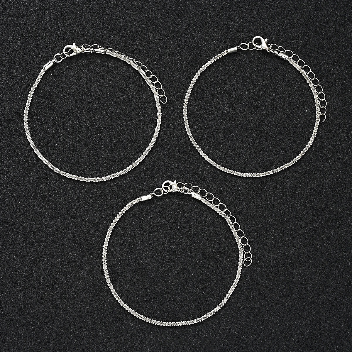 Elegant metal pendant anklet by LAQTA featuring intricate design and delicate chain for stylish ankle jewelry.