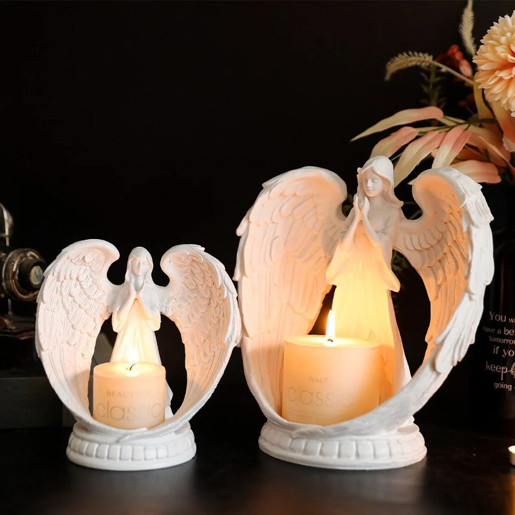 White angel candle holder by LAQTA with detailed angel figure and smooth finish, designed to hold a small candle or tealight.