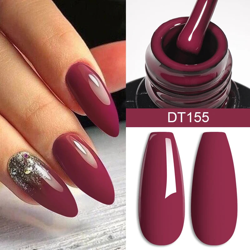 LAQTA red gel nail polish with crystal accents, showcasing a glossy, vibrant finish on neatly manicured nails.