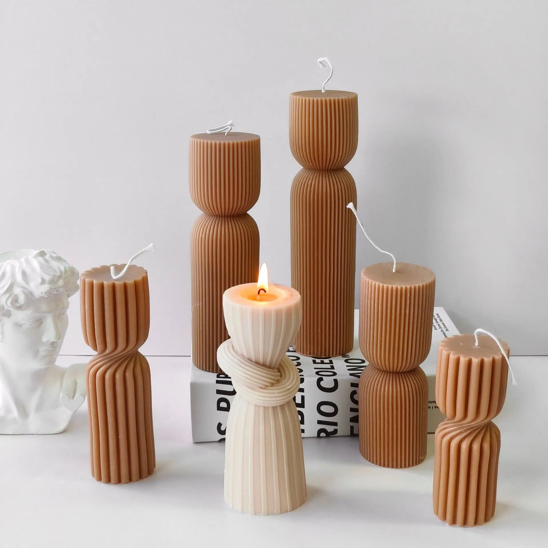 Striped cylinder aroma candle silicone mold by LAQTA, showing the flexible mold with striped pattern for candle making.