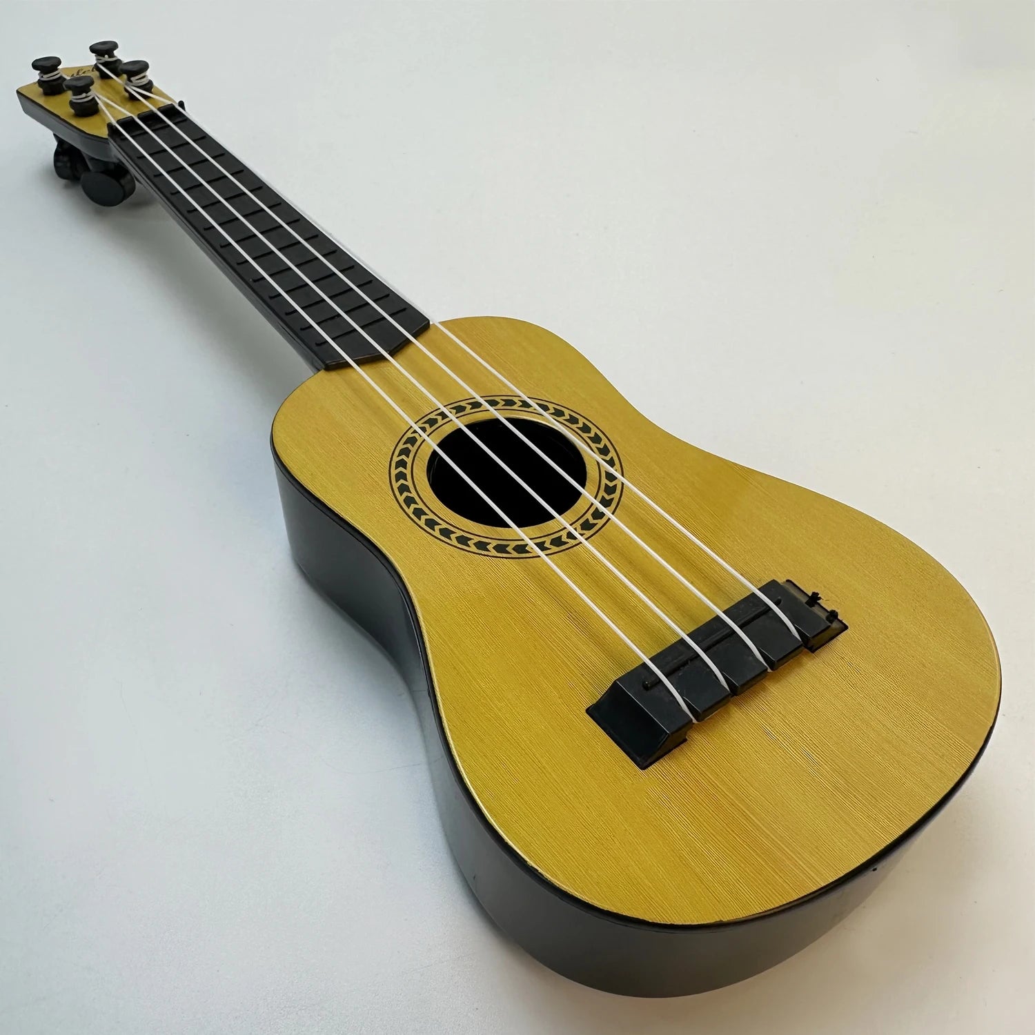 LAQTA music-oriented children's guitar toy with colorful buttons and strings, designed for young kids to play and learn music.