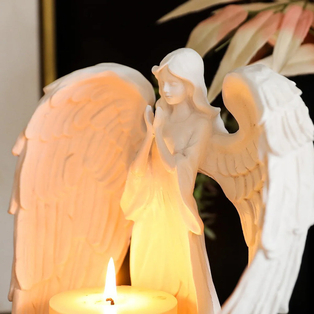 White Angel Candle Holder by LAQTA featuring a detailed angel design and a platform for candles