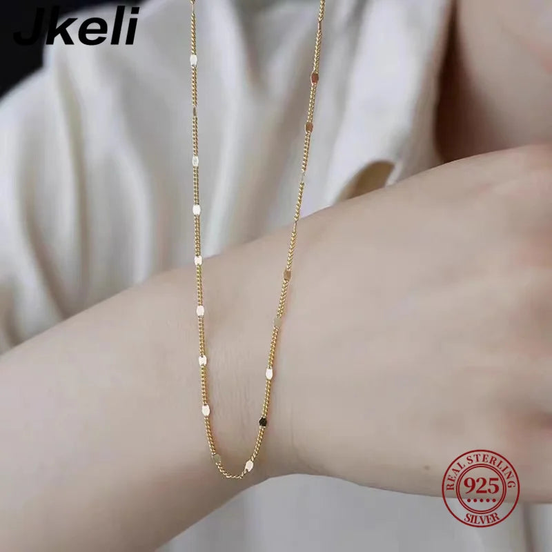 Sterling silver women's necklace by LAQTA featuring a delicate chain and elegant design, displayed on a neutral background.