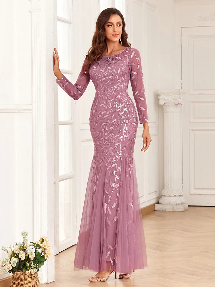 Elegant mermaid evening dress by LAQTA featuring shimmering fabric and intricate design, perfect for formal events.