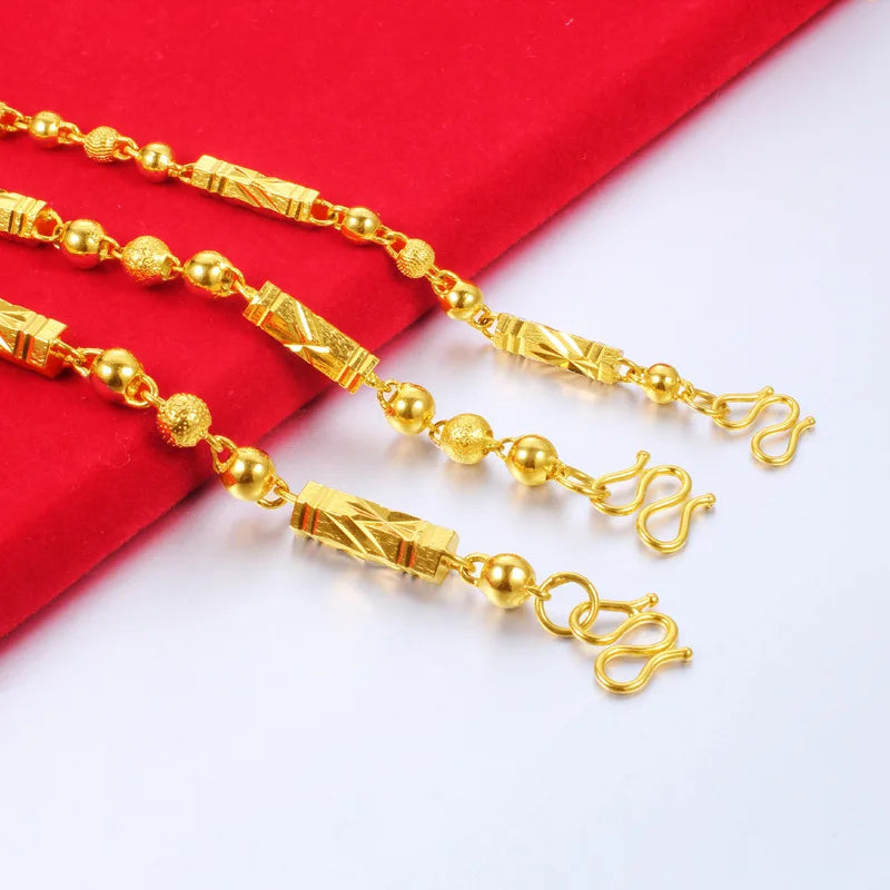 Electroplated 18K gold necklace by LAQTA featuring a delicate chain and elegant design on a white background.