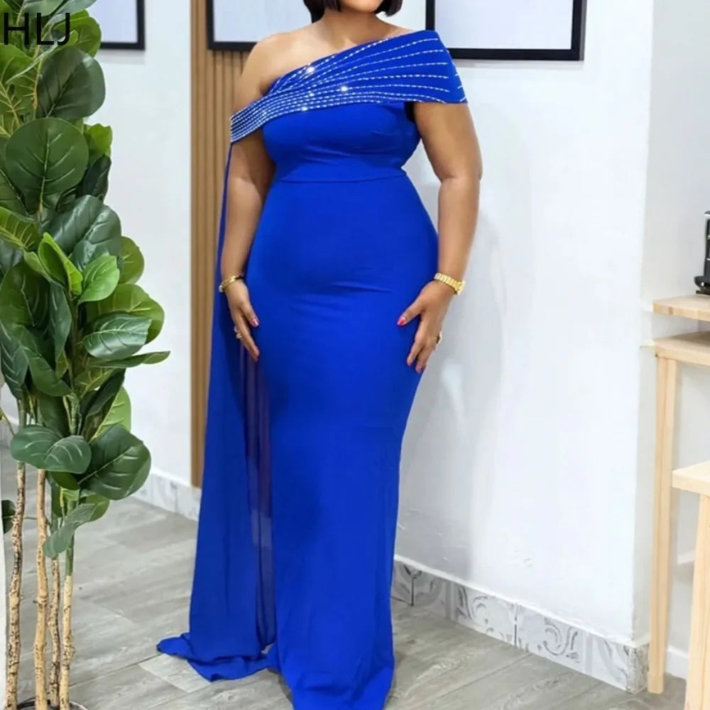 LAQTA sexy rhinestone patchwork bodycon long dress, close-up of fitted black dress with sparkling rhinestone details and elegant design.