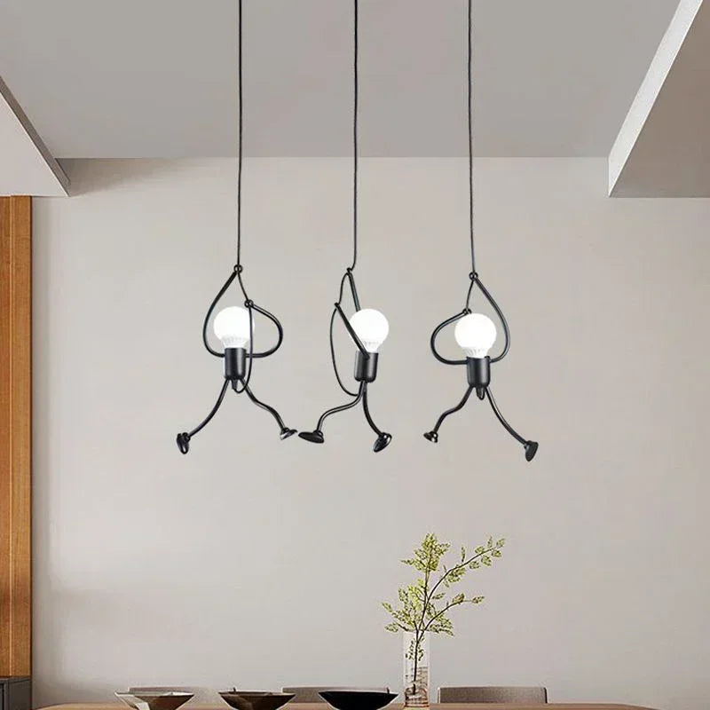 Vintage iron Little Man Pendant Light by LAQTA, featuring a whimsical design with a rustic finish and exposed bulb for modern decor.