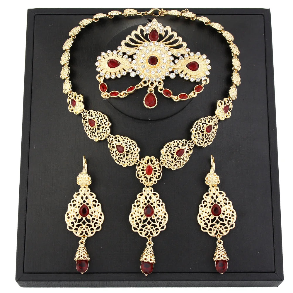 Elegant Moroccan bride jewelry by LAQTA featuring intricate gold-toned designs and traditional embellishments.