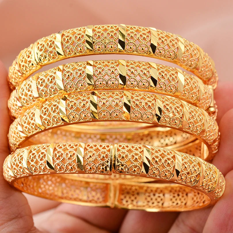 LAQTA 24k Dubai gold color bangles showcasing shiny, intricate gold jewelry with traditional design.