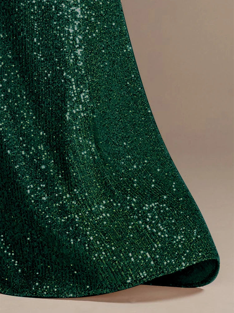 Elegant green evening dress by LAQTA featuring a flowing fabric and sophisticated design for evening occasions.