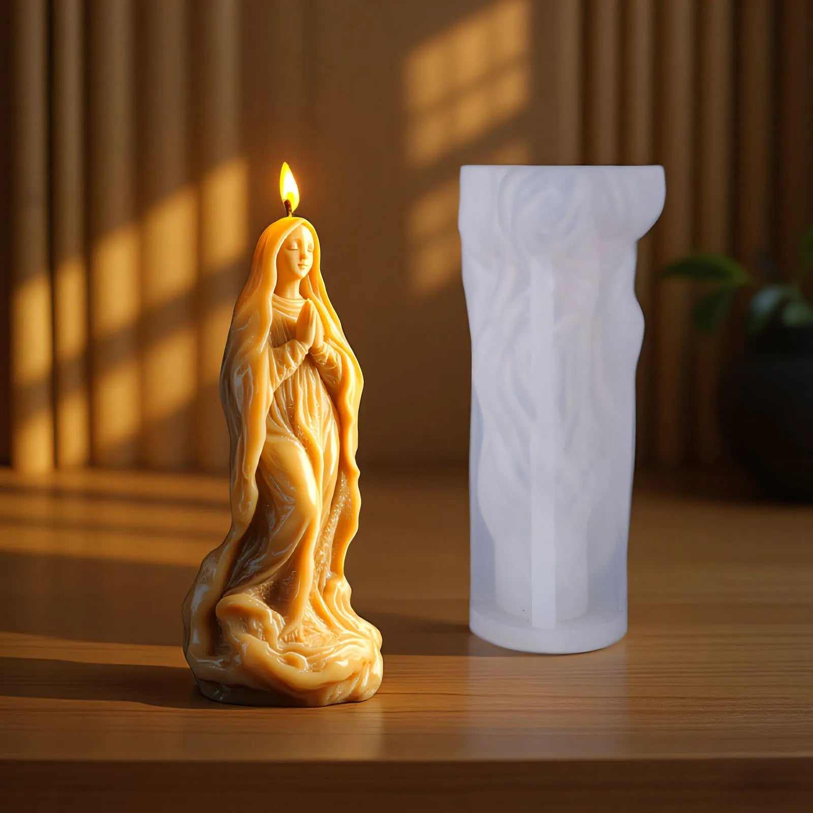 Silicone candle mold in Jesus statue design by LAQTA, showing detailed mold with religious figure for candle making.