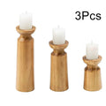 Natural wooden candlestick holders by LAQTA, showcasing polished wood with a classic design for elegant table decor.