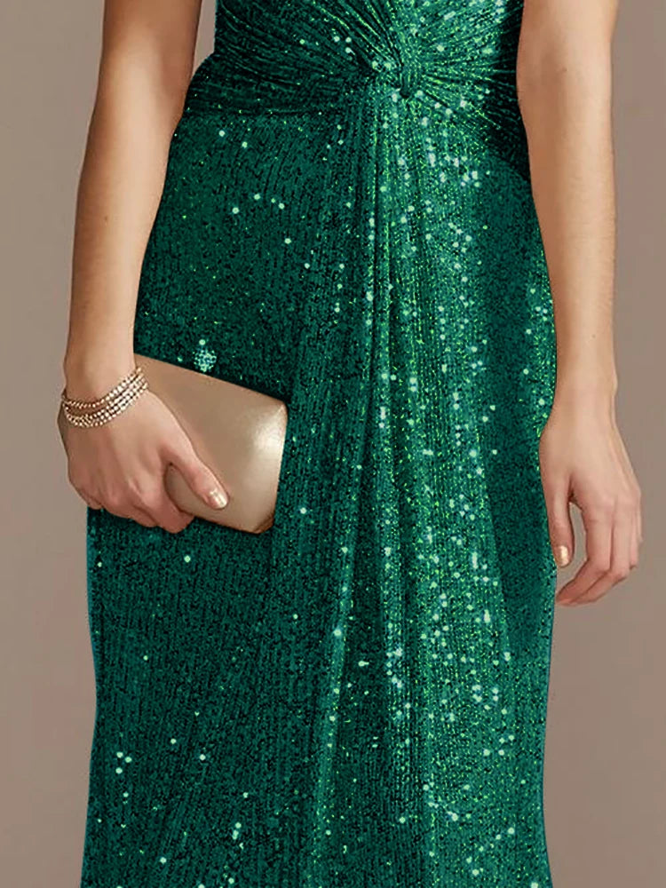 Elegant green evening dress by LAQTA featuring a flowing fabric and sophisticated design for formal occasions.
