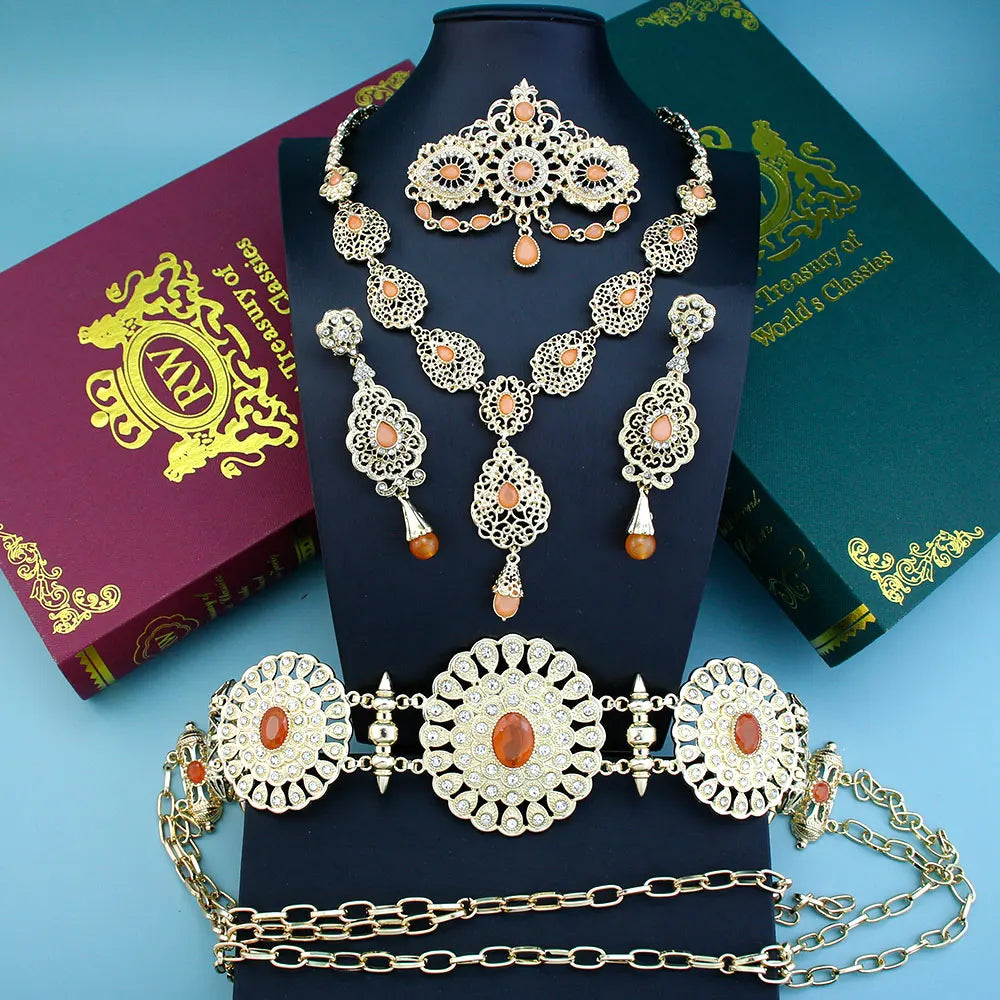 Elegant Arabic bride jewelry set by LAQTA featuring intricate gold and gemstone embellishments, including earrings and a necklace.