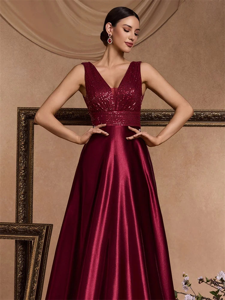 Elegant LAQTA sequins evening dress with intricate beadwork and a flowing silhouette, perfect for formal occasions.