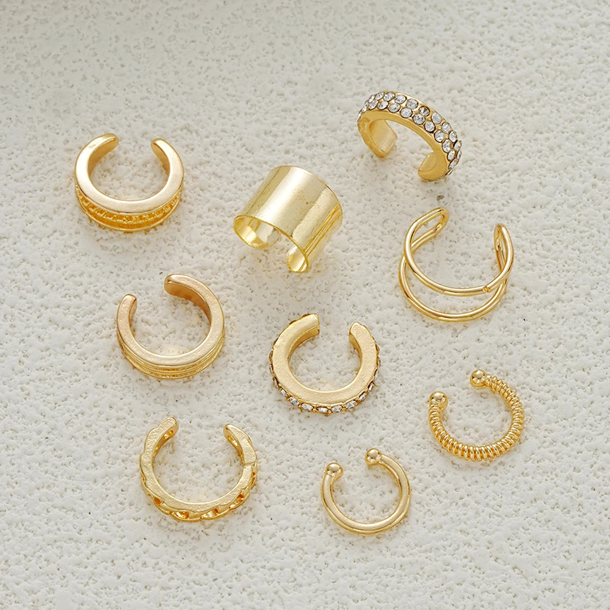 Gold LAQTA rhinestone clip-on earrings set featuring sparkling stones and a stylish, elegant design.