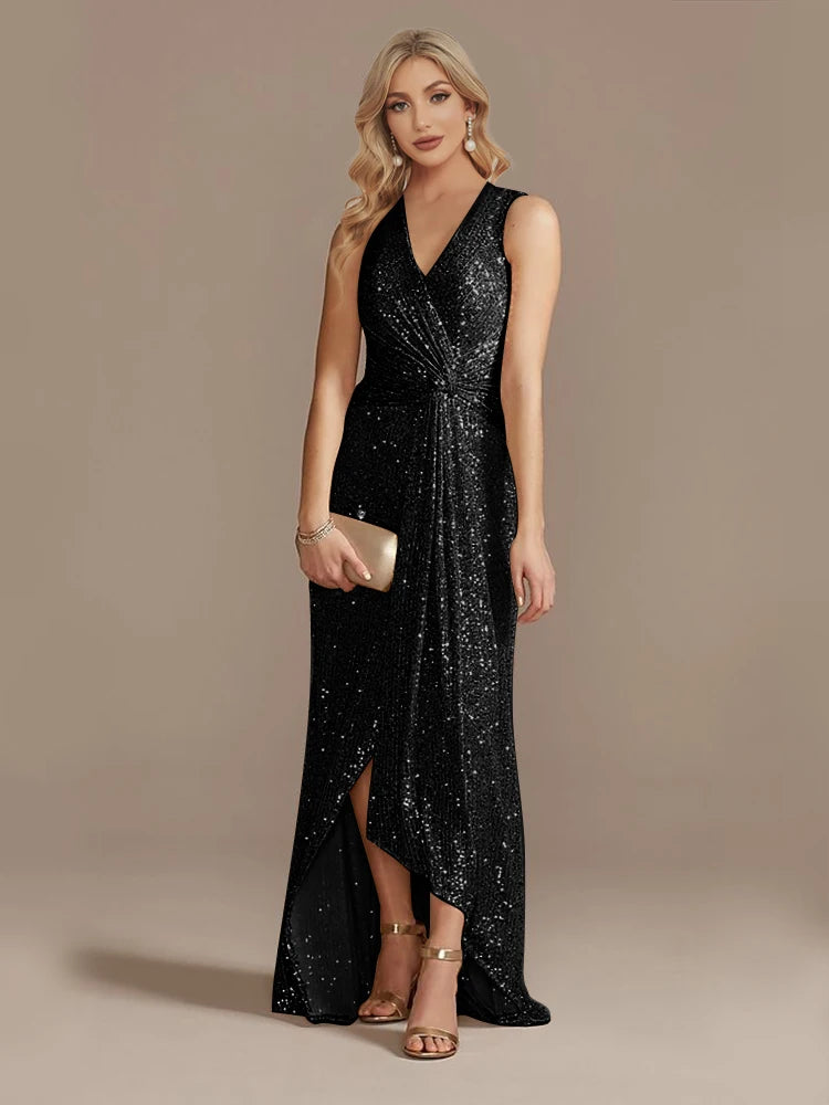 Elegant evening dress by LAQTA featuring a flowing black fabric and subtle embellishments, perfect for formal events.